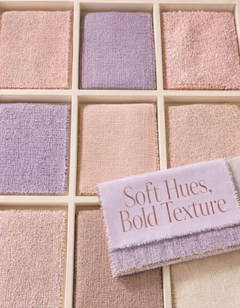 Pastel Grid Fabric Display Pastel-colored textured fabric swatches arranged in a grid display with soft lighting and a decorative label reading 'soft hues, bold texture'.